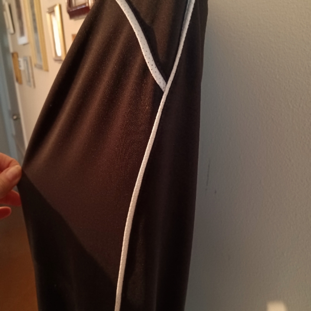 Black with white stripe warm up pants.
